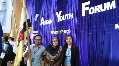 Faizul, Khairunnisa and Rachel standing proudly with the Brunei Flag
