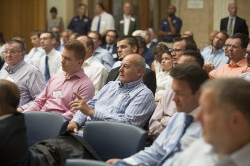 Attentive audience listening to presenters at the Regional Automotive and Aerospace Workshop in Budapest