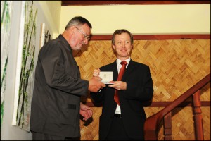 Receiving the Most Excellent Order of the British Empire from Quinton Quayle, British Ambassador to Thailand and Laos