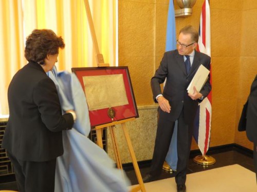 Baroness Minister presents a copy of the Magna Carta to UN Director General Michael Moeller