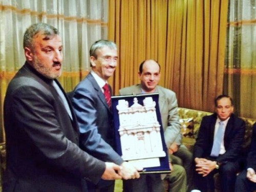 British Ambassador Peter Millett receiving a plaque during his visit to Ma'an