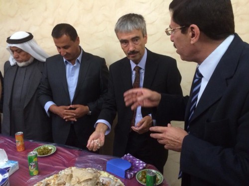 British Ambassador Peter Millett having Mansaf during a visit to one of the governorates in Jordan