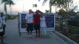 Governor and Jill Beckingham with Delano Williams n TCI
