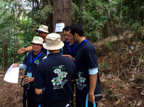 The Minister taking part in the forest orienteering activity