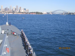 HMS Daring crew line the deck as the international fleet enters Sydney harbour