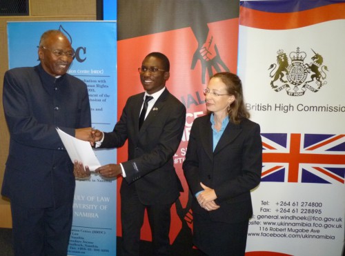Hon. Prof. Peter Katjavivi, Chief Whip of SWAPO Party, MP, receiving the declaration on ending sexual violence in conflict, from the Namibian youth.