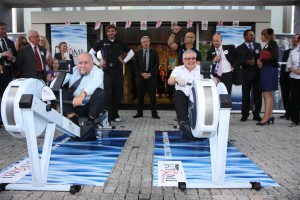 Senator Andrzej Person (left) and Ambassador Robin Barnett in a rowing machine duel during this year's Queen's Birthday Party