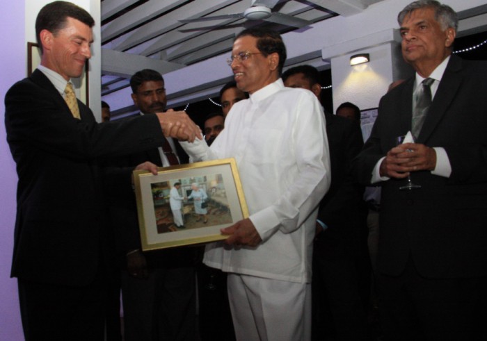 High Commissioner handingover Sri Lankan President a photograph of Her Majesty Queen Elizabeth the Second meeting Sri Lankan President.