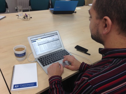 Jonathon at the Association of Commonwealth Universities (ACU) checks out the new Chevening system, taking notes on his Chevening notepaper, while enjoying a brew in his Chevening mug. The milk in the tea comes from cows farmed on the Chevening estate Lidl.