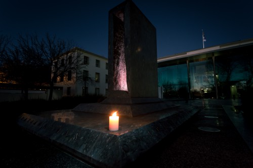 A single candle illuminates the war memorial in the grounds of the British High Commission, Canberra. 