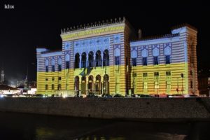 Sarajevo City Hall which was burned down in the war in 1990s lit in support of Ukraine