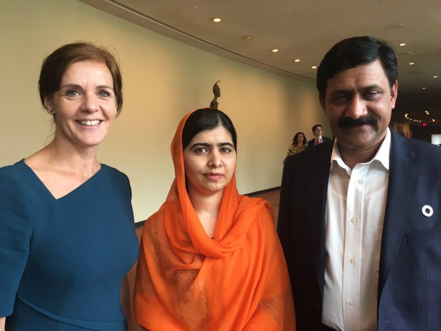 Joanna Roper with girls' education activist Malala Yousafzai and her father.