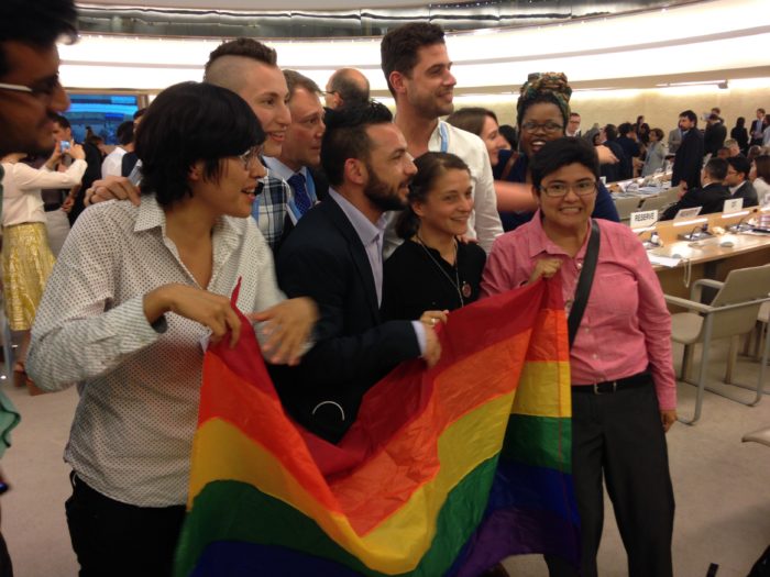 Civil society activists celebrate after adoption of the resolution