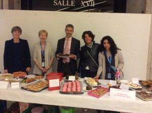 UK Mission colleagues selling cakes for refugees