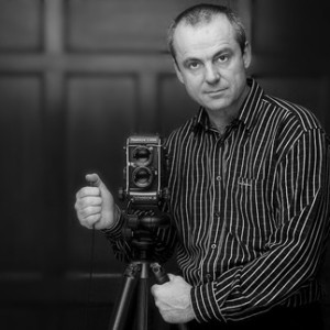 image of a photographer with his camera