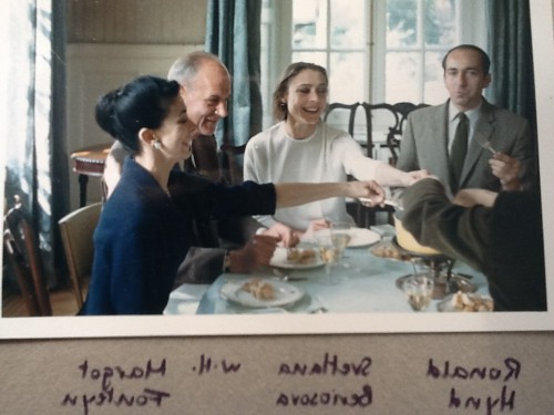 Eight of the principal dancers stayed at the Residence. This photo shows three of them at one of the meals, a fondue, together with Ambassador William Harpham (left).*